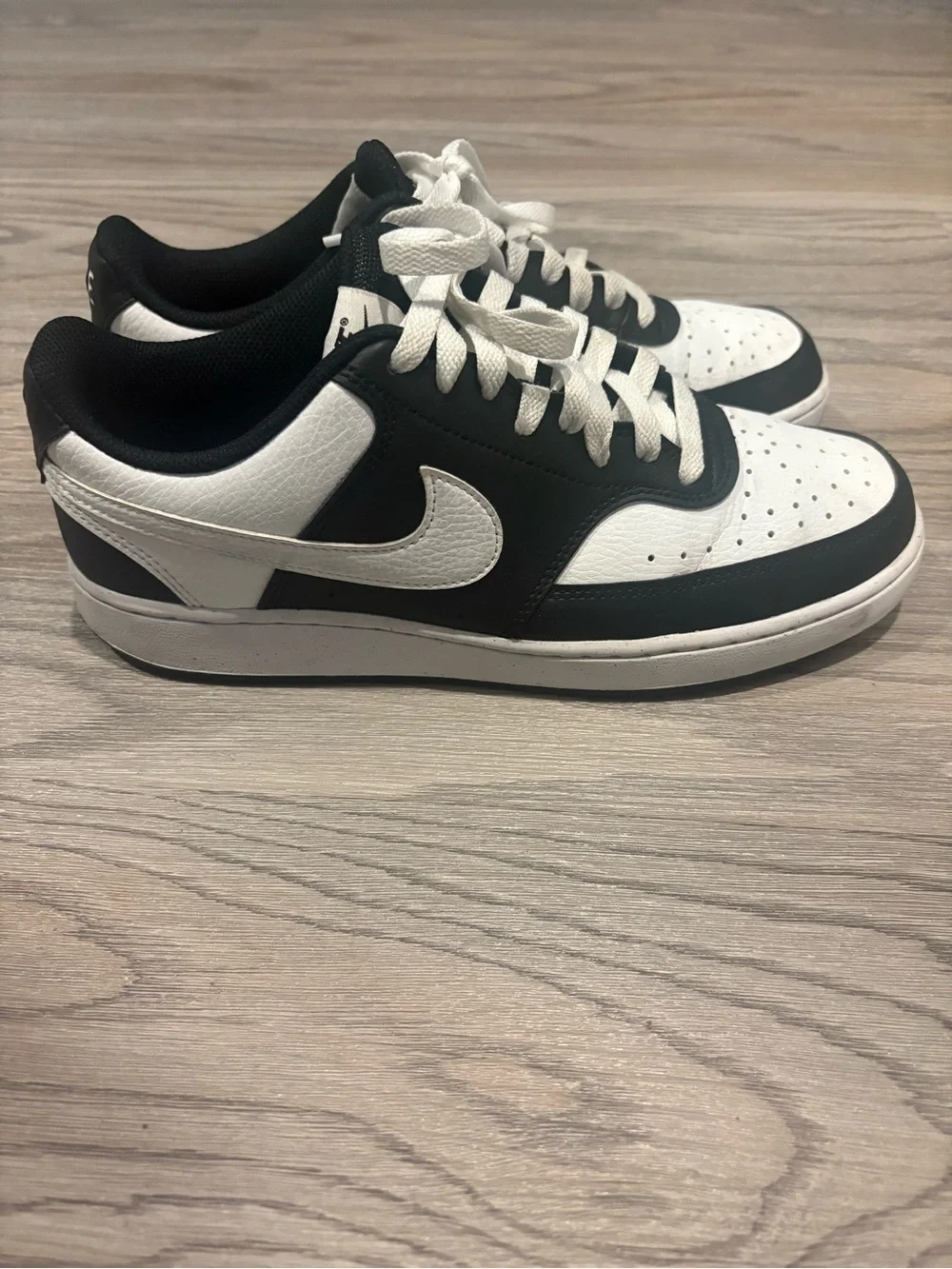 Nike Women’s Black and White Low-Top Sneakers with White Swoosh